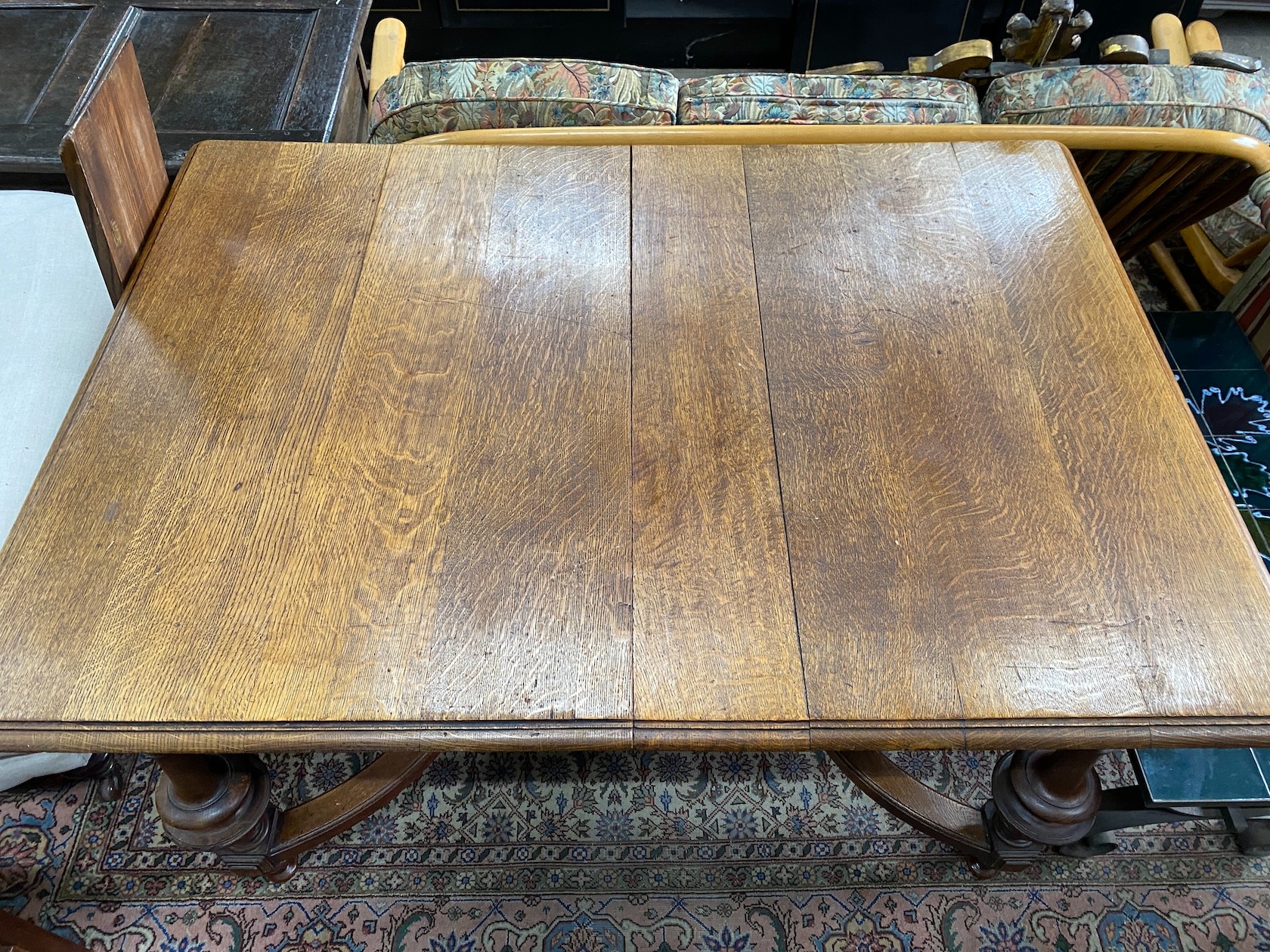 A late 19th / early 20th century French oak extending dining table, (one spare leaf) length 125cm, depth 99cm, height 77cm